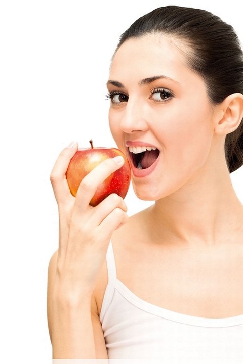 牙科保健——每天一个苹果(吃苹果的妇女)